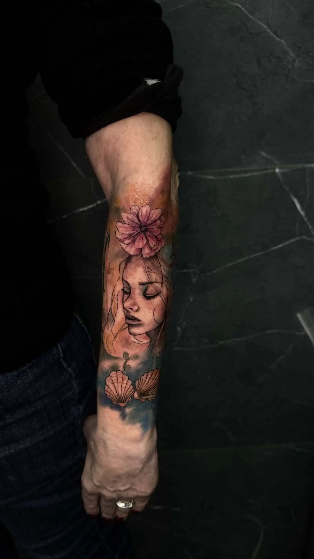 woman flower shells color realism forearm tattoo