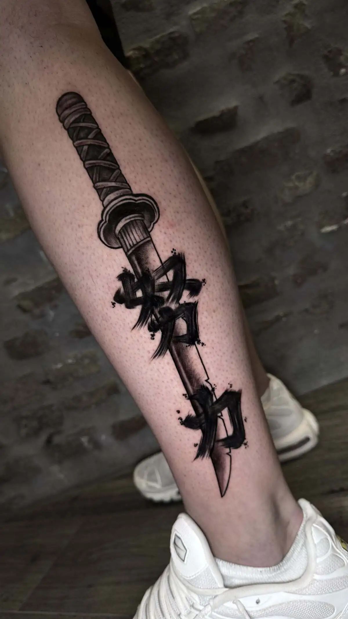 katana sword graffiti lettering calf tattoo