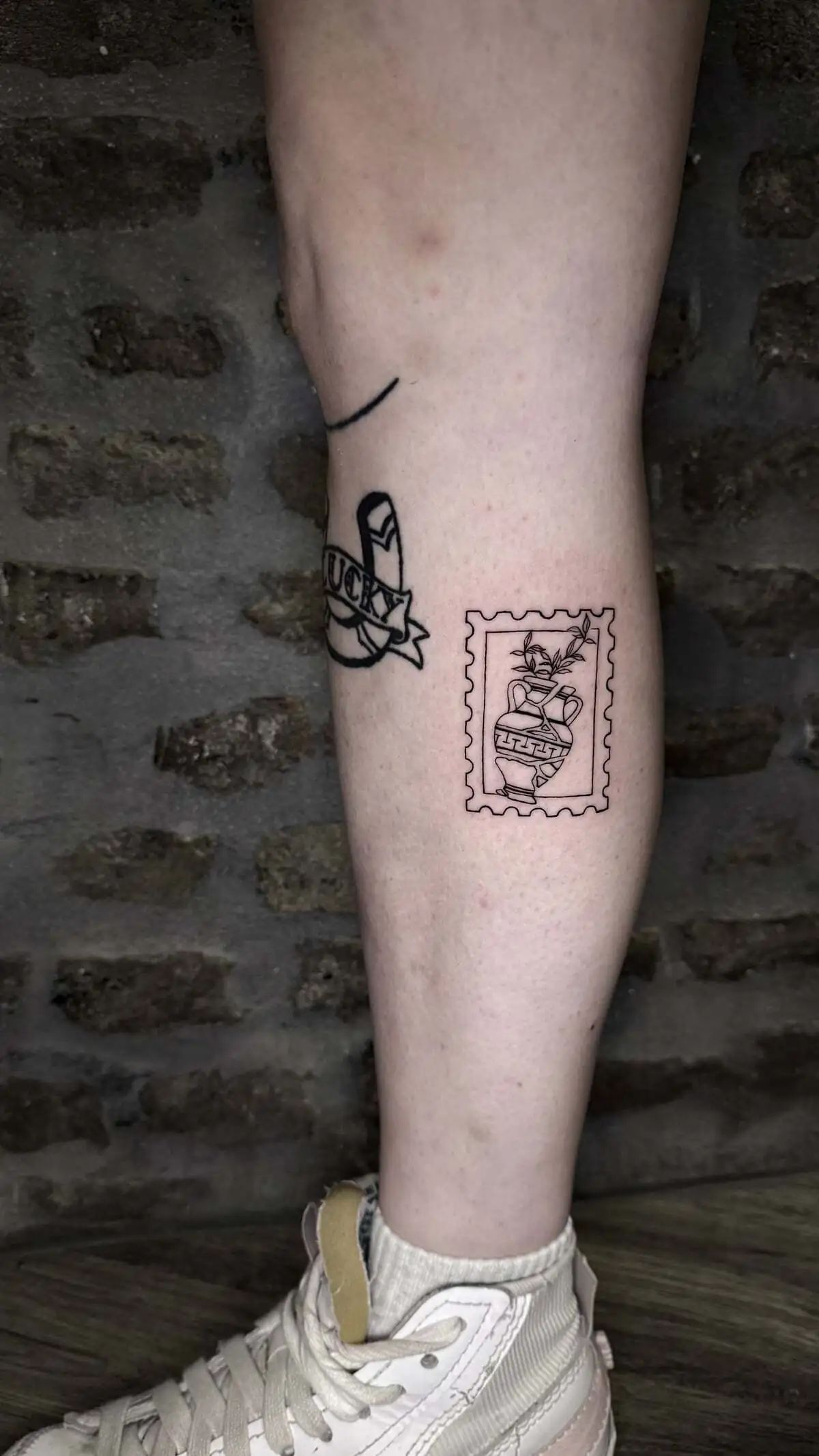 postage stamp greek amphora tattoo