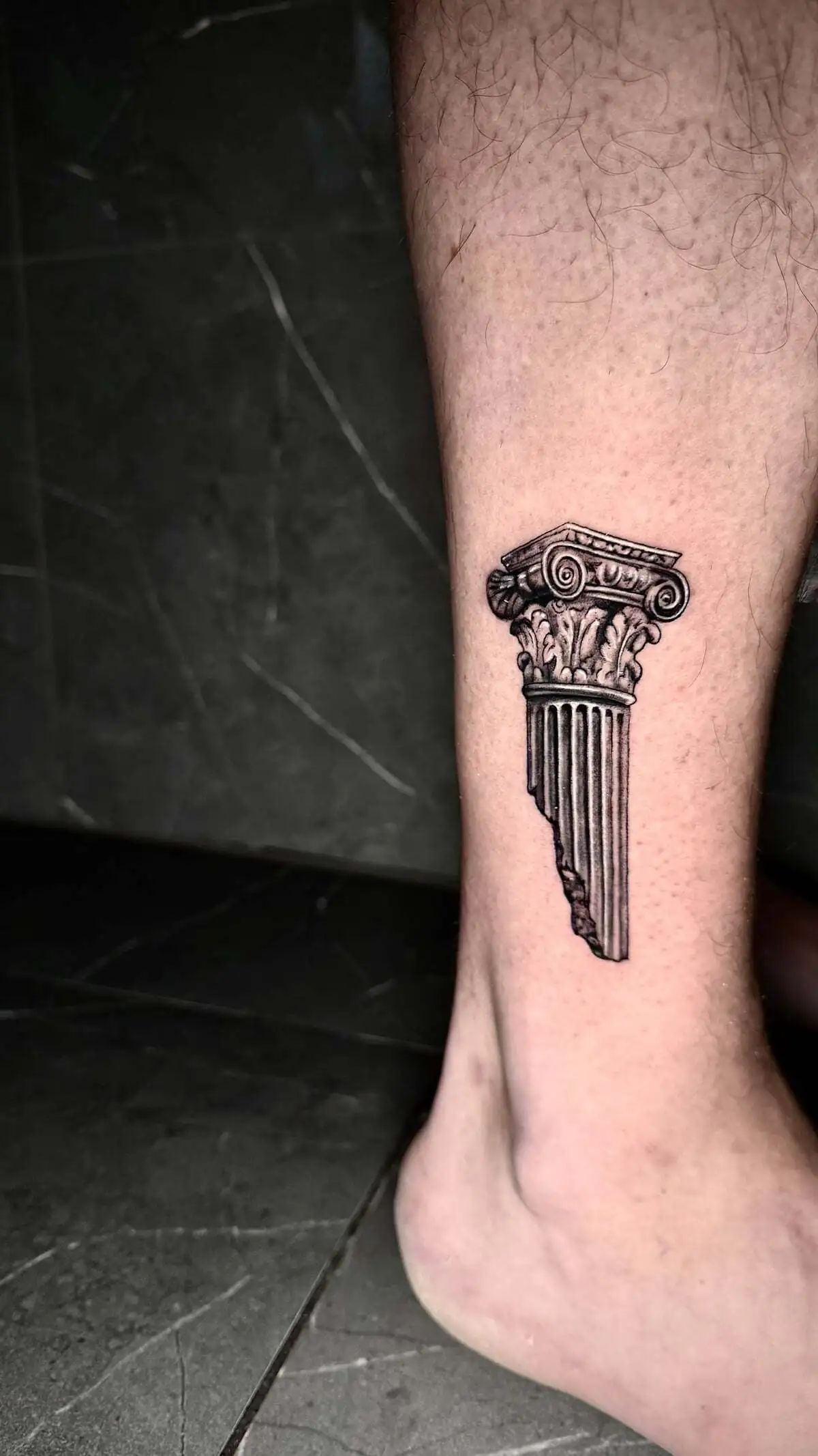 broken ionic column micro realism ankle tattoo