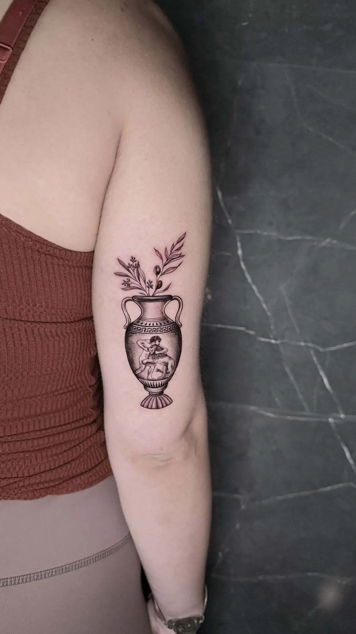 ancient greek amphora olive branches micro realism arm tattoo