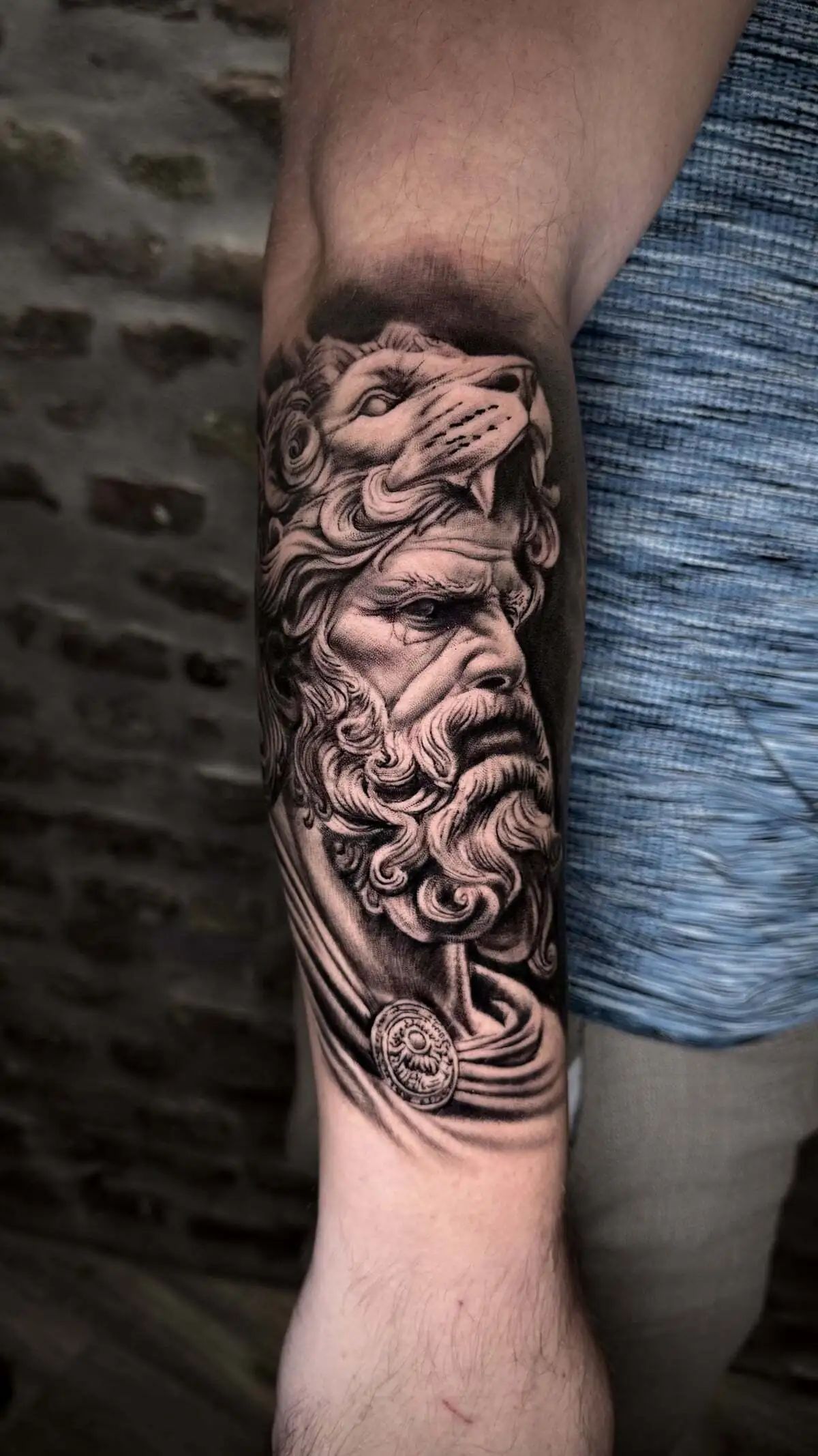 zeus bust lion headdress realistic forearm tattoo