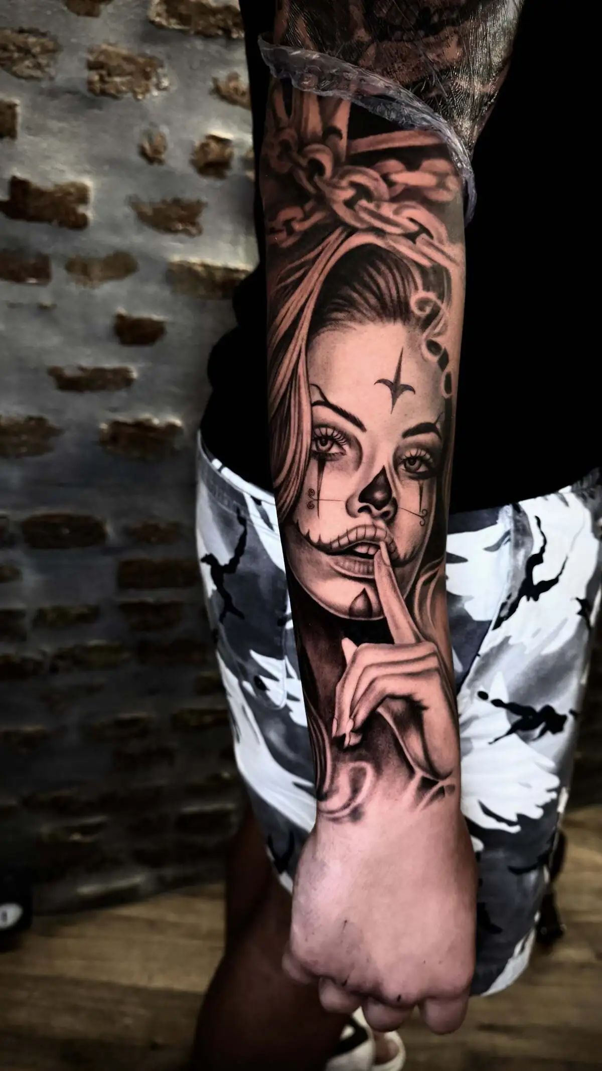 woman portrait sugar skull style realistic forearm tattoo
