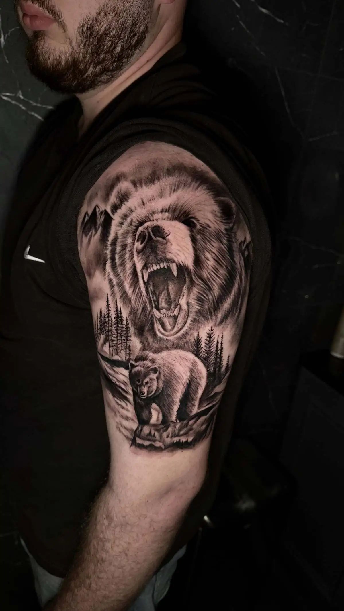 roaring bear forest landscape sleeve tattoo
