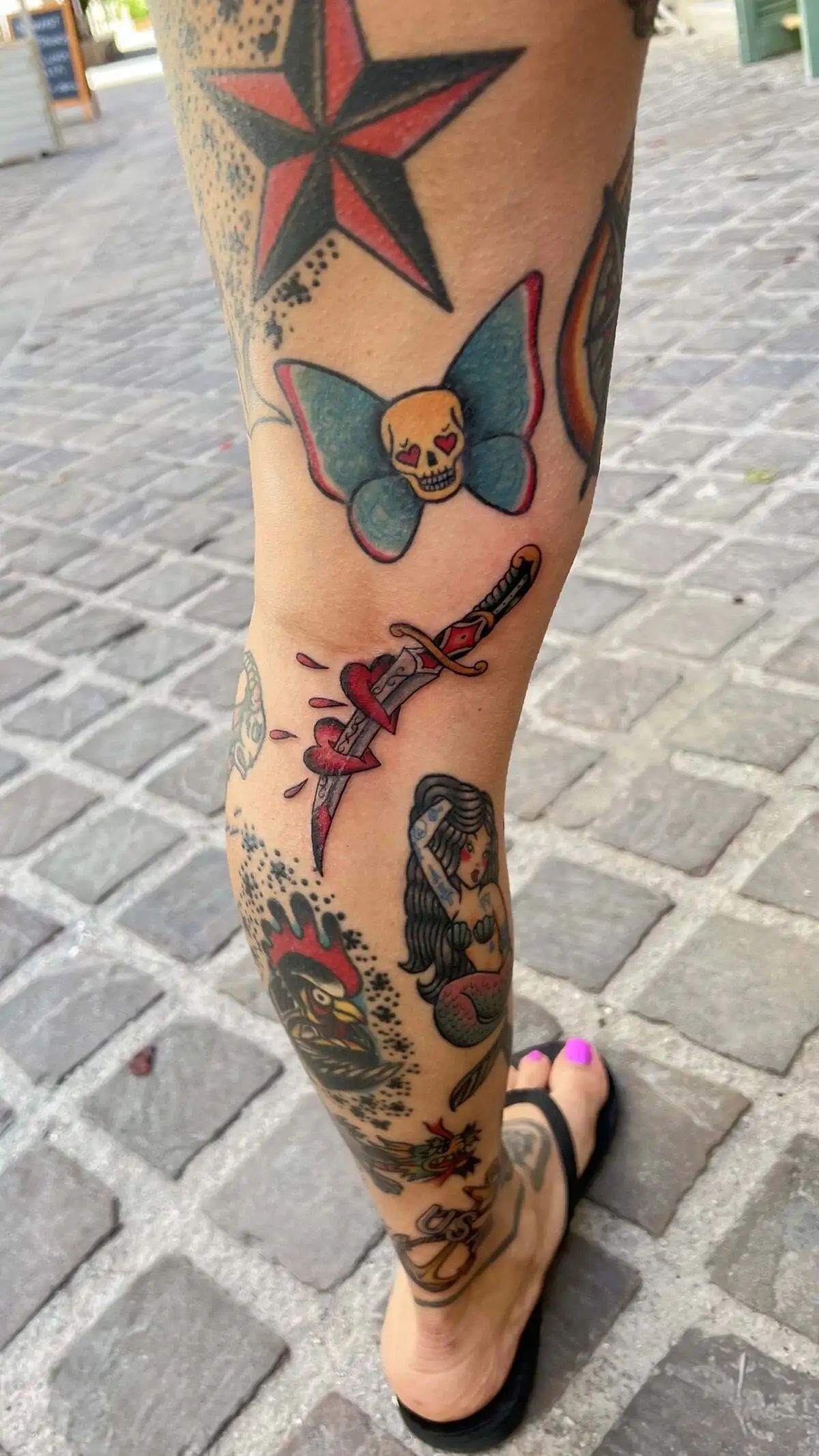 traditional dagger through heart leg tattoo